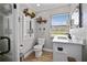 Updated bathroom with a walk-in shower, stylish vanity, and industrial shelving at 8403 Southwood Pines St, Lithia, FL 33547