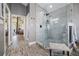 Bathroom boasts large shower with glass enclosure, and gray tile surround at 8403 Southwood Pines St, Lithia, FL 33547