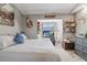 Cozy bedroom with a double bed and desk under a bay window at 8403 Southwood Pines St, Lithia, FL 33547
