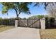 Private driveway gate with security and privacy features at 8403 Southwood Pines St, Lithia, FL 33547