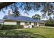 This home boasts solar panels, a well-maintained lawn, and a two-car garage at 8403 Southwood Pines St, Lithia, FL 33547