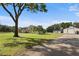 A large well-kept lawn leads to this charming home and large detached garage at 8403 Southwood Pines St, Lithia, FL 33547