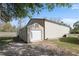 A side view of the detached garage with an additional attached storage building at 8403 Southwood Pines St, Lithia, FL 33547