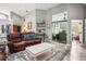 Open concept living room with high ceilings and stylish decor at 8403 Southwood Pines St, Lithia, FL 33547