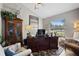 Well-lit office with a large desk, comfortable seating, and views of backyard at 8403 Southwood Pines St, Lithia, FL 33547