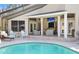 Relaxing outdoor space with a pool, patio furniture, and outdoor TV at 8403 Southwood Pines St, Lithia, FL 33547