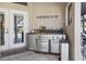 Outdoor kitchen featuring stainless steel grill and sink with mini fridge at 8403 Southwood Pines St, Lithia, FL 33547