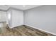 Empty bedroom features wood-look flooring and a closet at 9105 W Hillsborough Ave # I102, Tampa, FL 33615