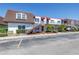 Condo building with stairwell access, red roofing, and nearby parking at 9105 W Hillsborough Ave # I102, Tampa, FL 33615
