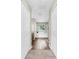 The luxurious bathroom features a soaking tub, a dark wood floor, and natural light at 934 Grand Canyon Dr, Valrico, FL 33594