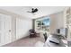 Bedroom featuring a ceiling fan, closet, and a window providing natural light at 934 Grand Canyon Dr, Valrico, FL 33594