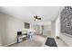 Open bonus room with a ceiling fan, neutral carpet, and plenty of natural light at 934 Grand Canyon Dr, Valrico, FL 33594