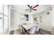 Dining area boasting a decorative ceiling fan and marble table with comfortable seating at 934 Grand Canyon Dr, Valrico, FL 33594