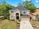 Charming two-story home featuring manicured landscaping and a spacious two car driveway at 934 Grand Canyon Dr, Valrico, FL 33594