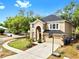 Charming two-story home featuring manicured landscaping and a spacious two car driveway at 934 Grand Canyon Dr, Valrico, FL 33594