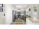 Kitchen features gray cabinets, stainless steel appliances, a pantry, and an eat-in island at 934 Grand Canyon Dr, Valrico, FL 33594