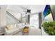 Inviting living room with a comfortable sectional sofa, staircase, and large window with natural light at 934 Grand Canyon Dr, Valrico, FL 33594