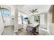 Open-concept living area with natural light, ceiling fans and wood-look floors at 934 Grand Canyon Dr, Valrico, FL 33594