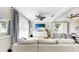 Bright living room featuring comfortable sofa seating, neutral color palette, and ceiling fan at 934 Grand Canyon Dr, Valrico, FL 33594