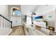 Bright living room featuring modern furniture, hardwood floors, a ceiling fan, and ample natural light at 934 Grand Canyon Dr, Valrico, FL 33594