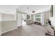The loft offers ample space with a white desk, neutral walls, carpet floors, and a sunlit window at 934 Grand Canyon Dr, Valrico, FL 33594