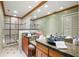Bathroom featuring and vessel sinks and updated shower at 10 James Ct, Oldsmar, FL 34677