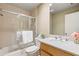 Light filled bathroom featuring shower and tub combo at 10 James Ct, Oldsmar, FL 34677