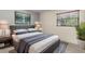 Comfortable bedroom with a modern bed, soft rug, stylish bedside table, and ample natural light at 10 James Ct, Oldsmar, FL 34677