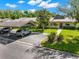 Charming home featuring a covered parking area and well-maintained front yard landscaping at 10 James Ct, Oldsmar, FL 34677
