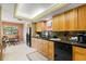 Well-lit kitchen featuring sleek black appliances and cozy breakfast nook for casual dining at 10 James Ct, Oldsmar, FL 34677