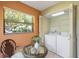 Bright eat-in kitchen area with in-house laundry closet at 10 James Ct, Oldsmar, FL 34677