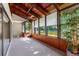 Enclosed sunroom with lots of natural light, a view of the lake, and bright neutral carpet at 10 James Ct, Oldsmar, FL 34677