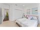 Bedroom with plush carpet, closet and view into hallway at 10007 Hazelnut Ct, Tampa, FL 33647