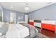 This primary bedroom features hardwood floors, a modern light fixture and contemporary design at 10007 Hazelnut Ct, Tampa, FL 33647