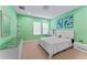 Bedroom features include bright green walls, neutral carpeting, and ample natural light at 10007 Hazelnut Ct, Tampa, FL 33647