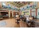 Open clubhouse with lounge area, kitchen, tall ceilings and many ceiling fans at 10007 Hazelnut Ct, Tampa, FL 33647