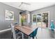 Bright dining area with a view of the pool and backyard, offering seamless indoor-outdoor living at 10007 Hazelnut Ct, Tampa, FL 33647