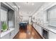 Modern kitchen with a large island and seating, stainless steel appliances, and lots of gray cabinet space at 10007 Hazelnut Ct, Tampa, FL 33647