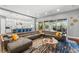 Open floor plan shows the living room leading into the kitchen and outdoor entertaining area at 10007 Hazelnut Ct, Tampa, FL 33647