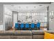 Open floor plan shows the living room leading into the kitchen with a large island and seating at 10007 Hazelnut Ct, Tampa, FL 33647