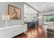 Open-concept living area blending seamlessly into the kitchen, featuring hardwood floors and abundant natural light at 10007 Hazelnut Ct, Tampa, FL 33647