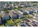 Spacious aerial view highlights neighborhood's layout with fences, yards, and houses at 10222 Cool Waterlily Ave, Riverview, FL 33578