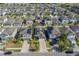 A drone shot exhibits roofs equipped with solar panels in a densely packed neighborhood at 10222 Cool Waterlily Ave, Riverview, FL 33578