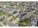 Expansive aerial view showcases neighborhood layout and home's location relative to surrounding houses at 10222 Cool Waterlily Ave, Riverview, FL 33578