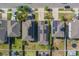 Birds eye view of home with solar panels and well maintained landscaping in a suburban neighborhood at 10222 Cool Waterlily Ave, Riverview, FL 33578