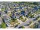 Bird's-eye view presenting neighborhood's structured layout, including home designs and backyards at 10222 Cool Waterlily Ave, Riverview, FL 33578