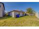 Spacious backyard with green grass and fence, great for outdoor activities at 10222 Cool Waterlily Ave, Riverview, FL 33578