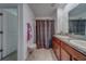 Bathroom featuring double vanity, granite countertops, shower, and tile flooring at 10222 Cool Waterlily Ave, Riverview, FL 33578