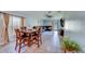 Comfortable dining area with seating for four, open to living space, and bright natural light at 10222 Cool Waterlily Ave, Riverview, FL 33578