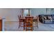 Well-lit dining area with tile floors and views to living area at 10222 Cool Waterlily Ave, Riverview, FL 33578